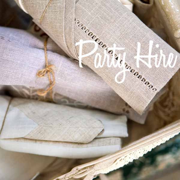 Stack of neatly rolled table linens ready for an event