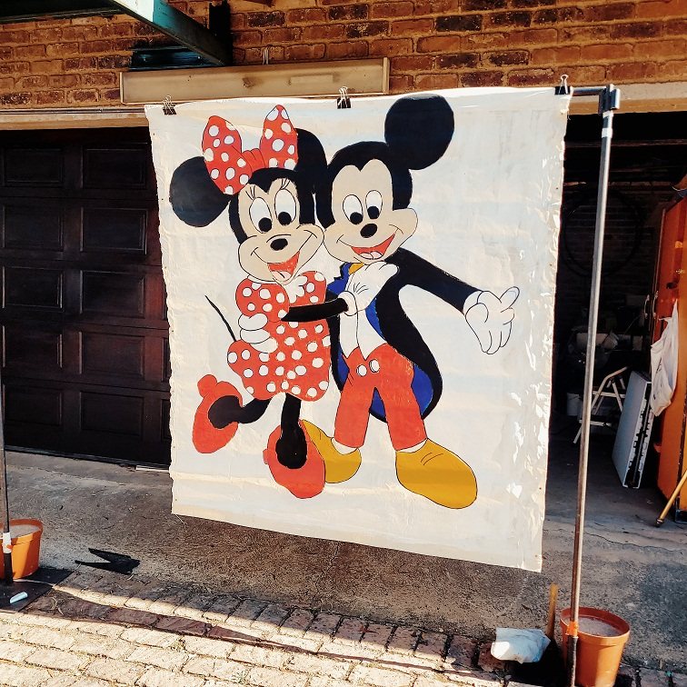 Hand-painted Mickey and Minnie Mouse banner