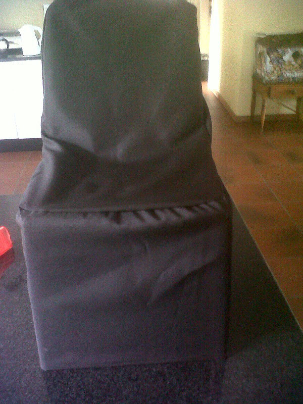 Black chair cover on a chair in a kitchen
