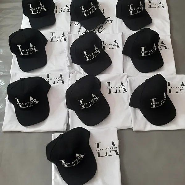 Branded caps and T-shirts arranged on a table