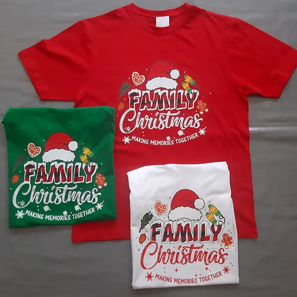 Three Family Christmas T-shirts in red, green, and white.