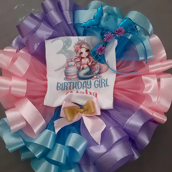 Colorful birthday decorations with a personalized shirt and accessories