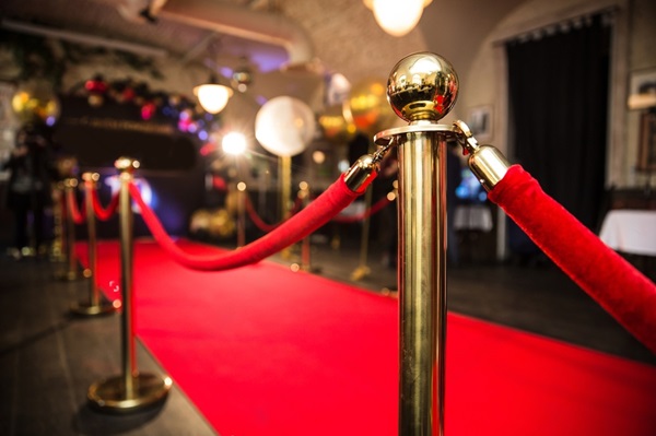 Red carpet with gold stanchions and velvet ropes