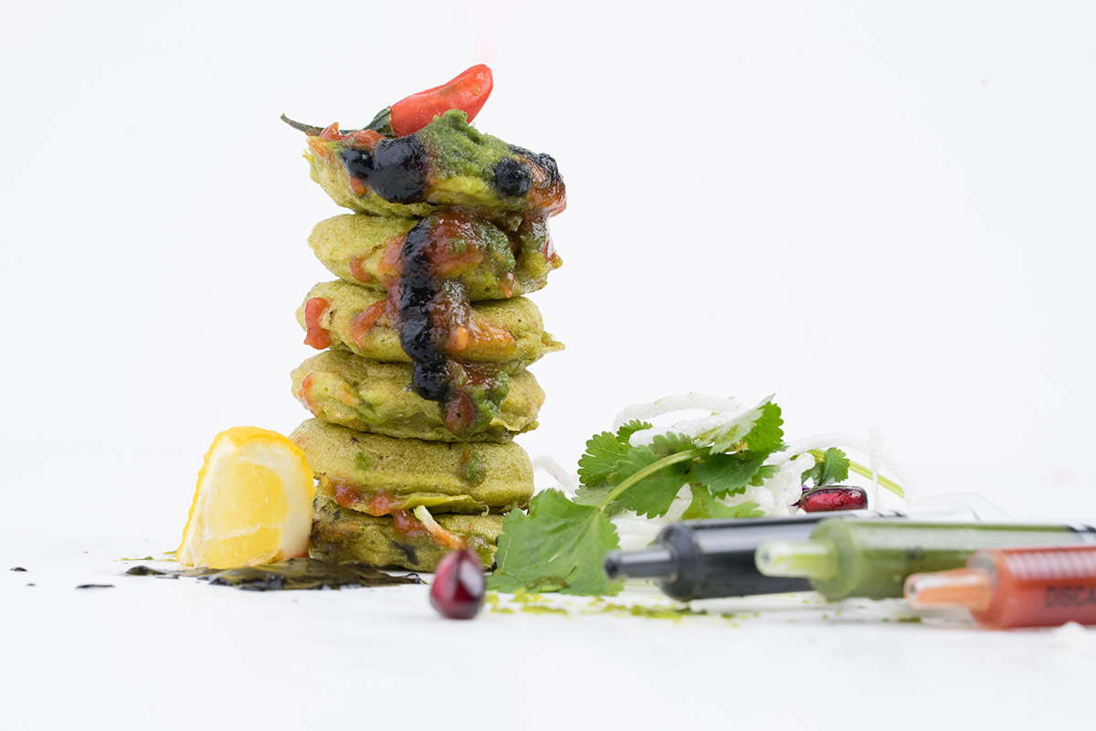 Stacked pancakes with toppings and garnishes