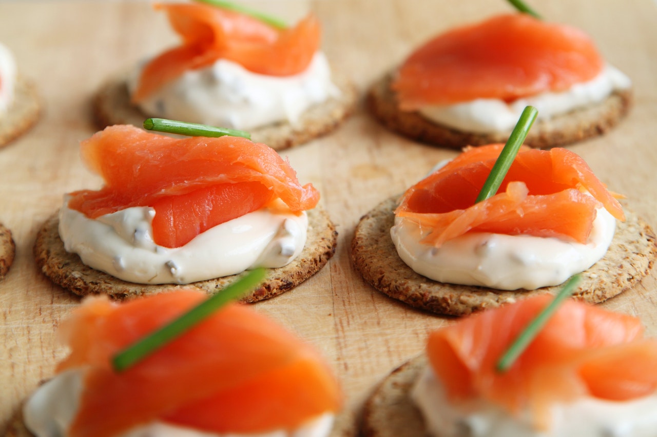 Salmon canapés on a wooden board