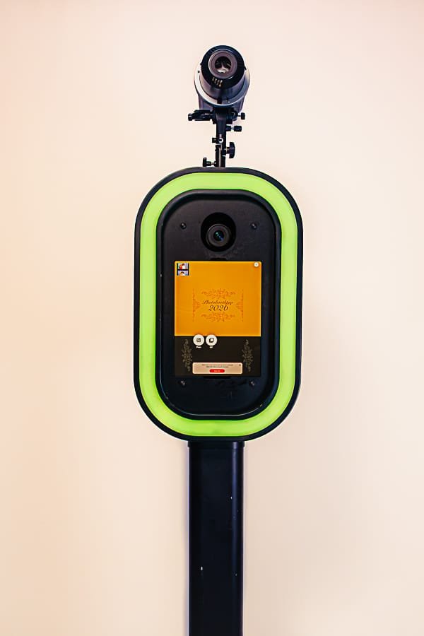 Sleek 360 video booth with green borders and camera