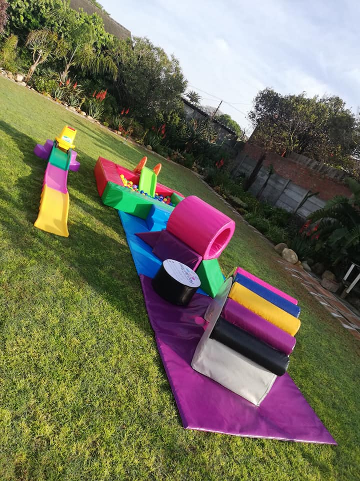 Colorful soft play equipment in a garden