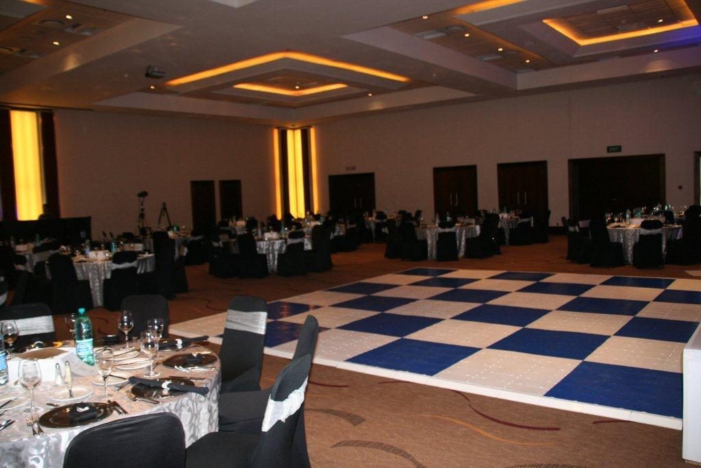 Checkered black and white dance floor in a decorated venue
