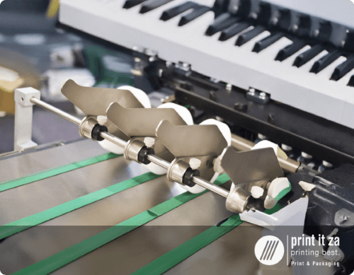 Close-up of printing equipment used for custom invitations.