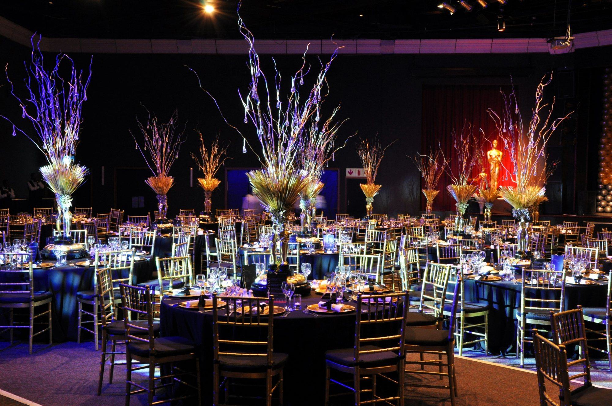 Dining setup with decorated tables and centerpieces