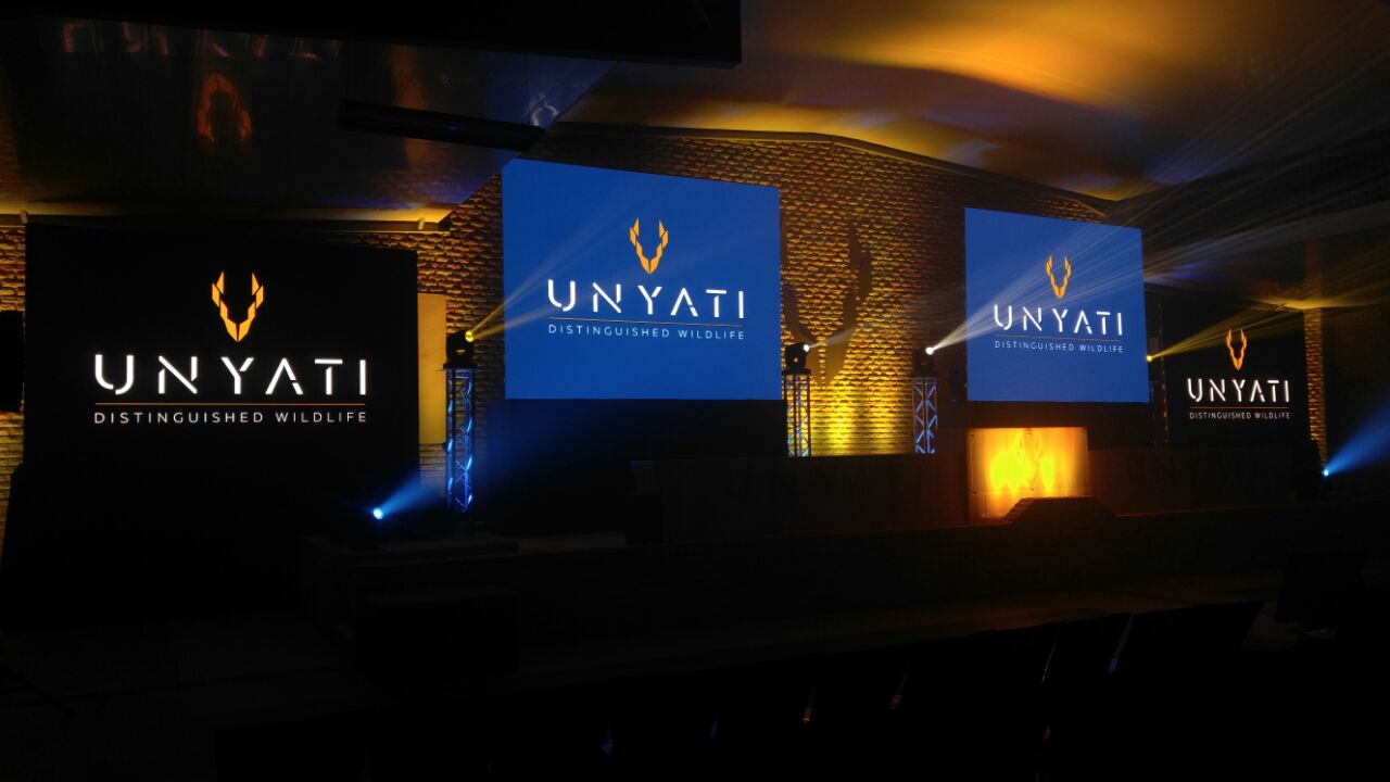 Lighting setup featuring Unyati branding at an event.