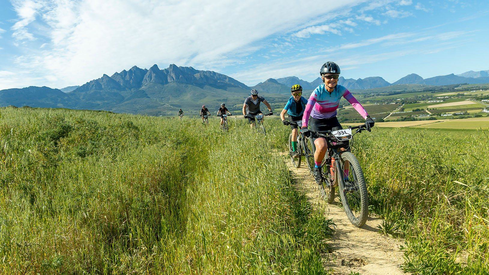 Group of mountain bikers riding on a scenic trail