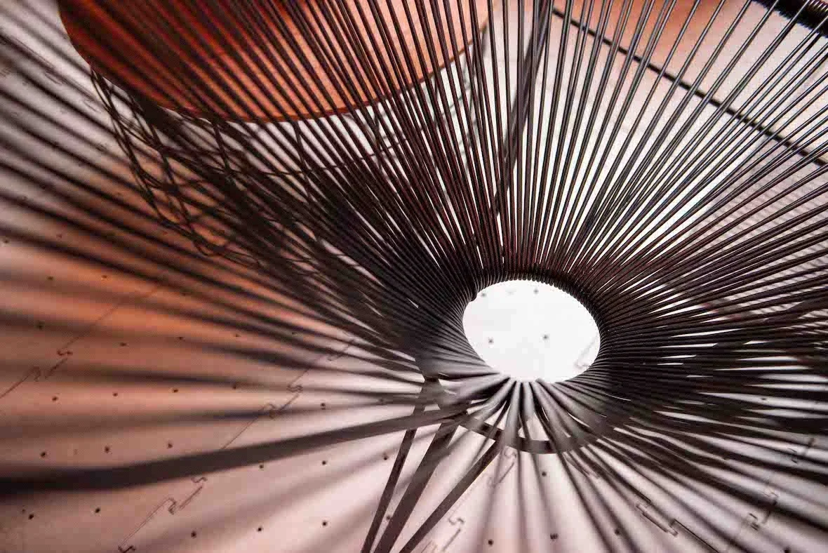 Close-up of a metal bar stool casting shadows