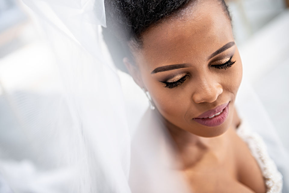 Close-up of a bride with soft features and veil