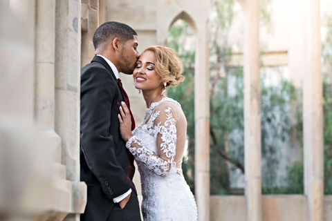 A couple kissing in a scenic outdoor setting