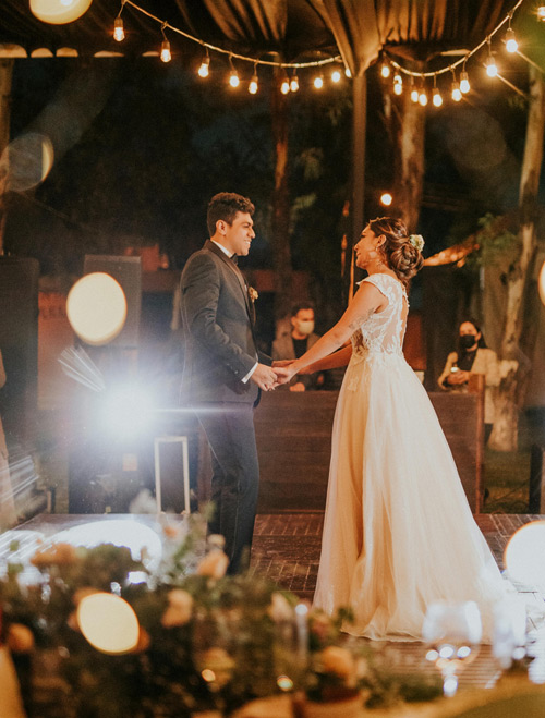Couple dancing under lights at an event