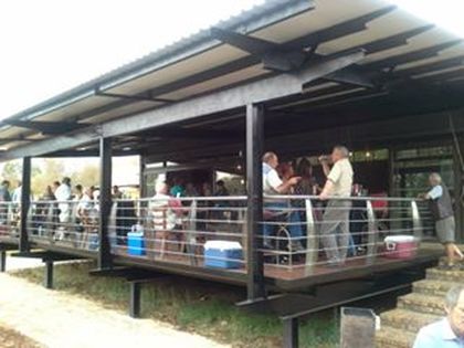 Outdoor deck area of Riverside Venue with guests enjoying the space