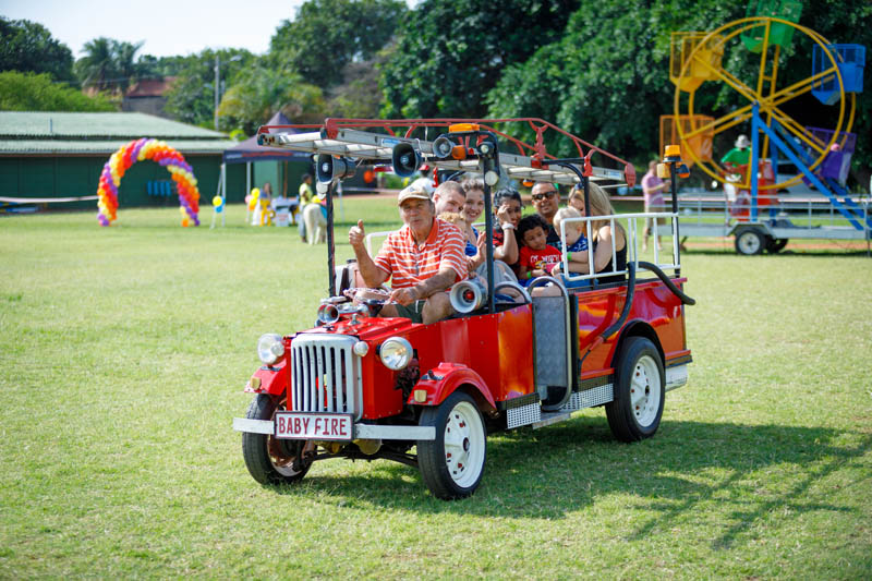 Group of people enjoying a ride in a mini car