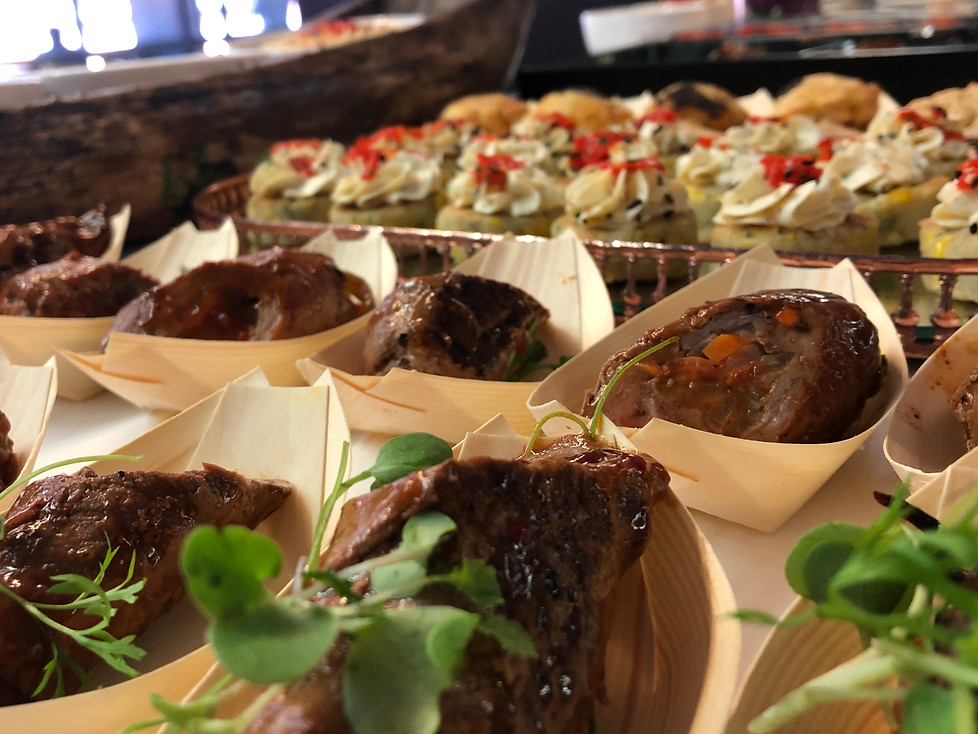 Various halaal gourmet dishes arranged on a serving platter