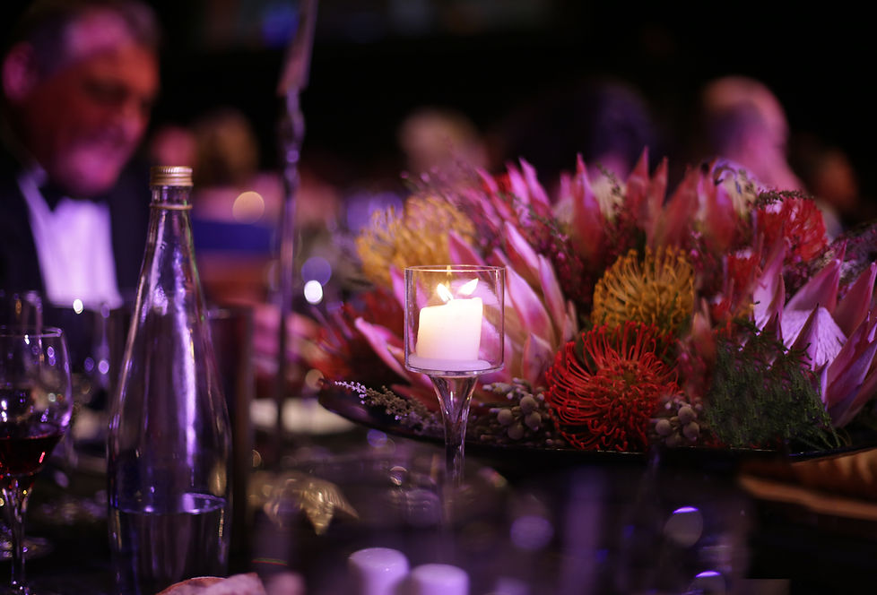 Table centerpiece with flowers and a candle