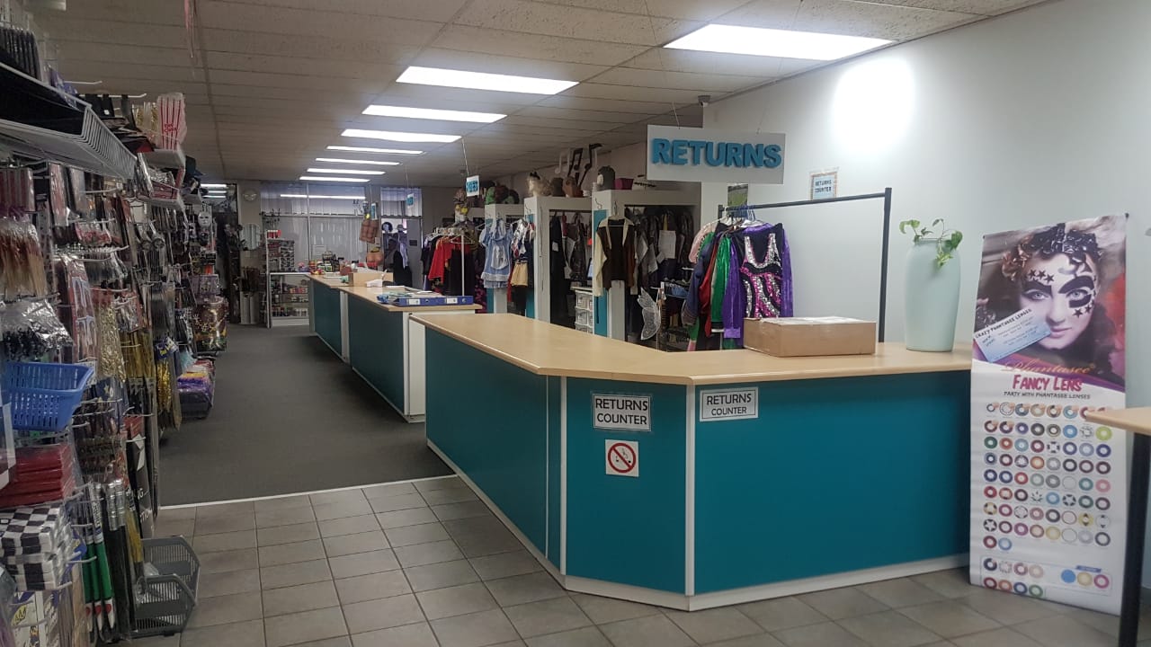 Interior view of costume hire shop with returns counter.