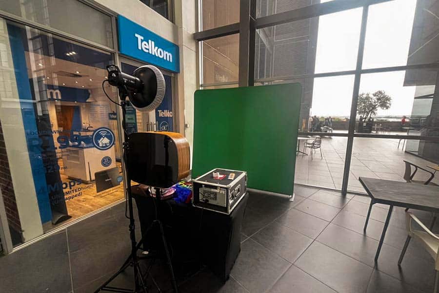 Green screen backdrop with lighting setup for a photo booth
