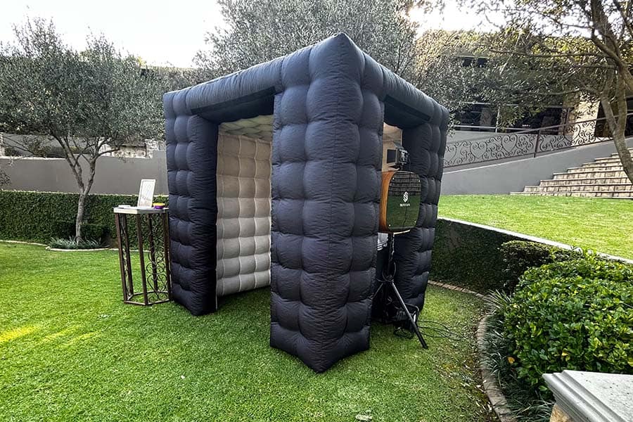 Inflatable photo booth in a garden setting