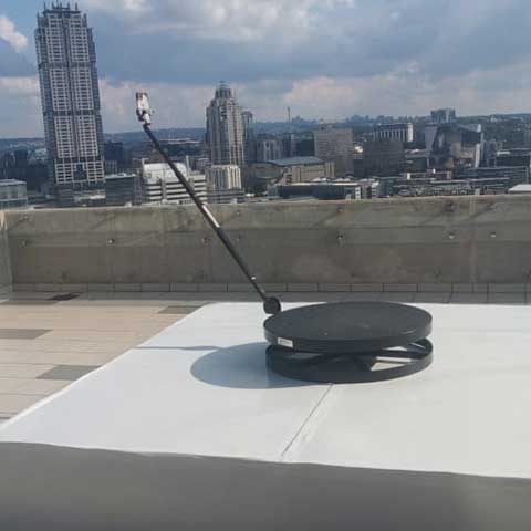 360° spin booth on a rooftop with Johannesburg skyline