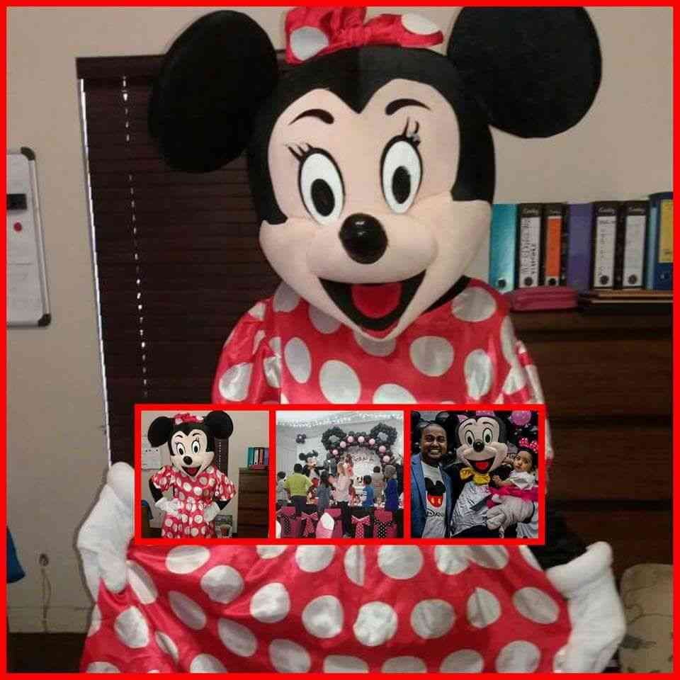 Person in a Minnie Mouse costume with polka dots