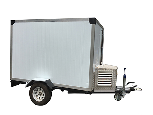 Side view of a mobile fridge trailer with a silver frame