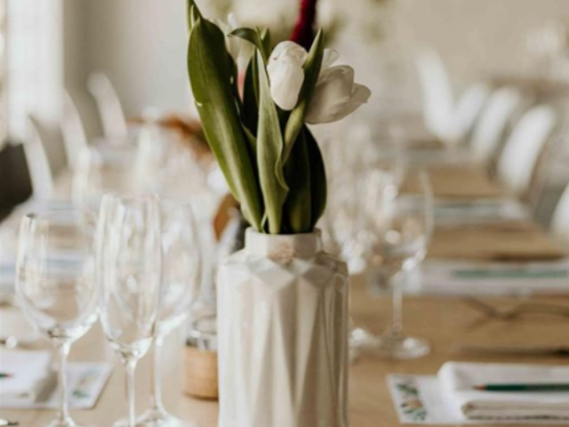 Floral centerpiece in a vase on a dining table
