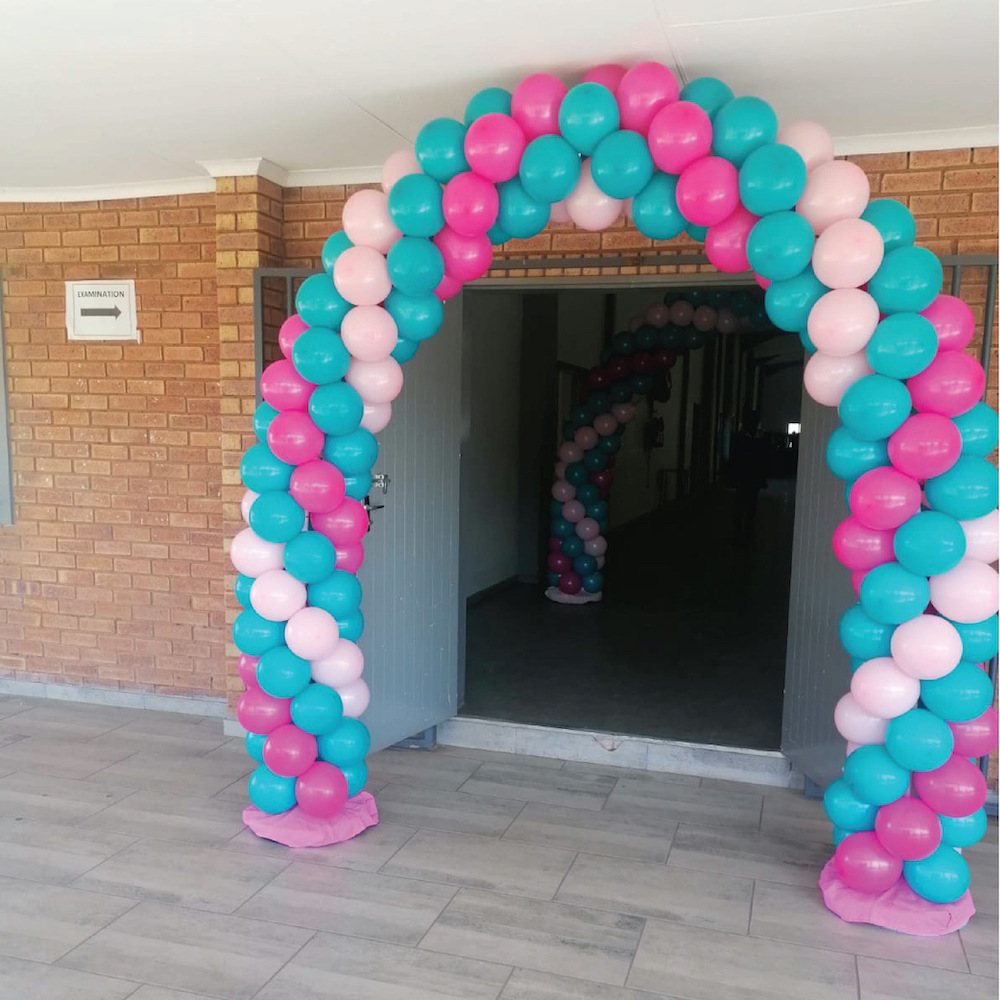 Colorful balloon arch in pink, teal, and blue