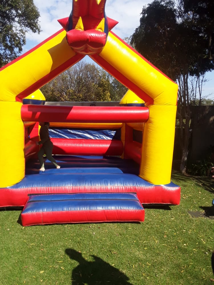 Crocodile themed jumping castle with red and yellow colors