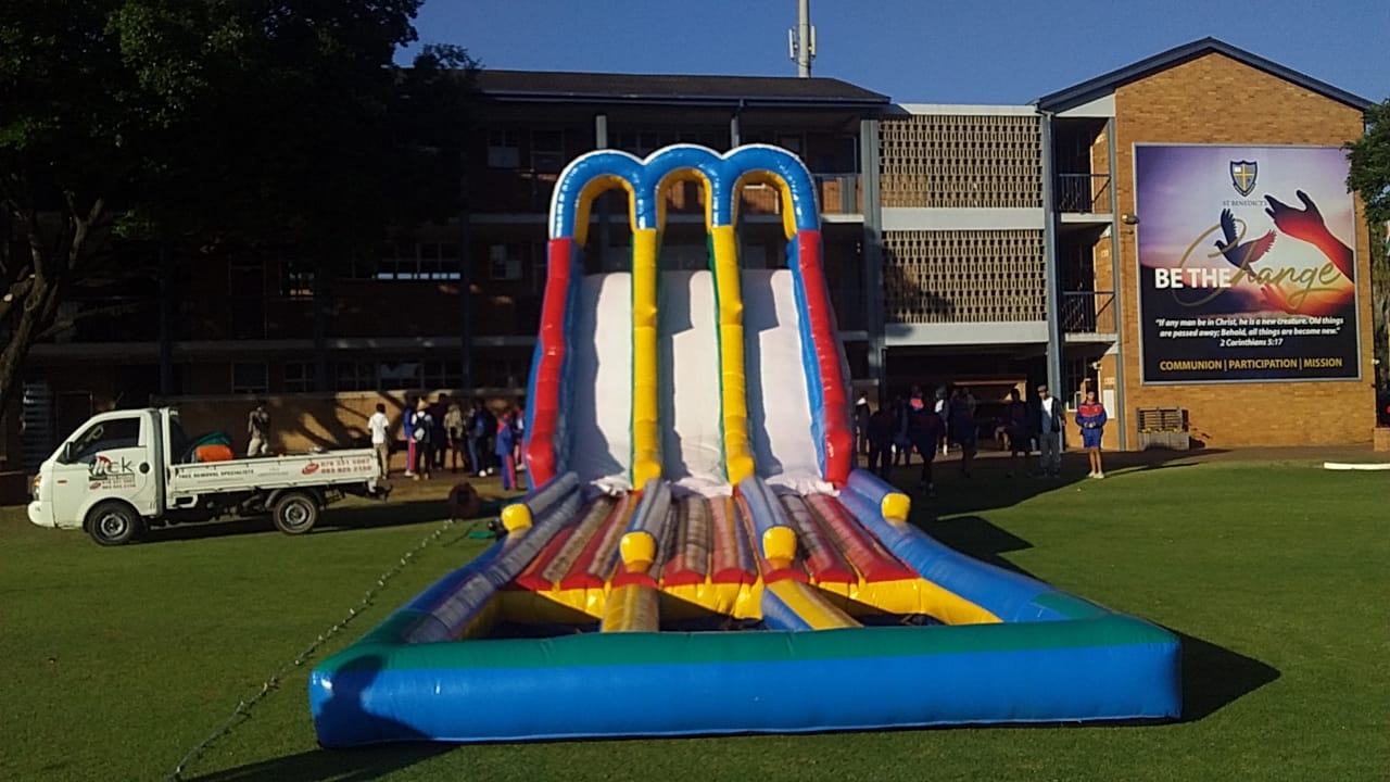 Mini Giant Water Slide set up on a grassy area