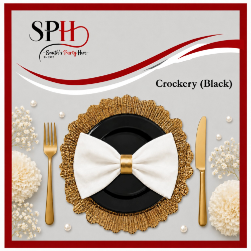 Black crockery with golden bowtie napkin on decorative charger plate