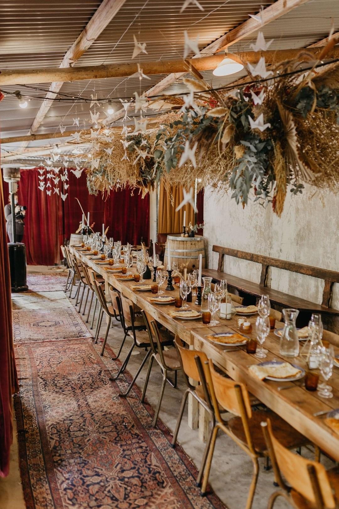 Rustic style table with decorative elements in a venue.
