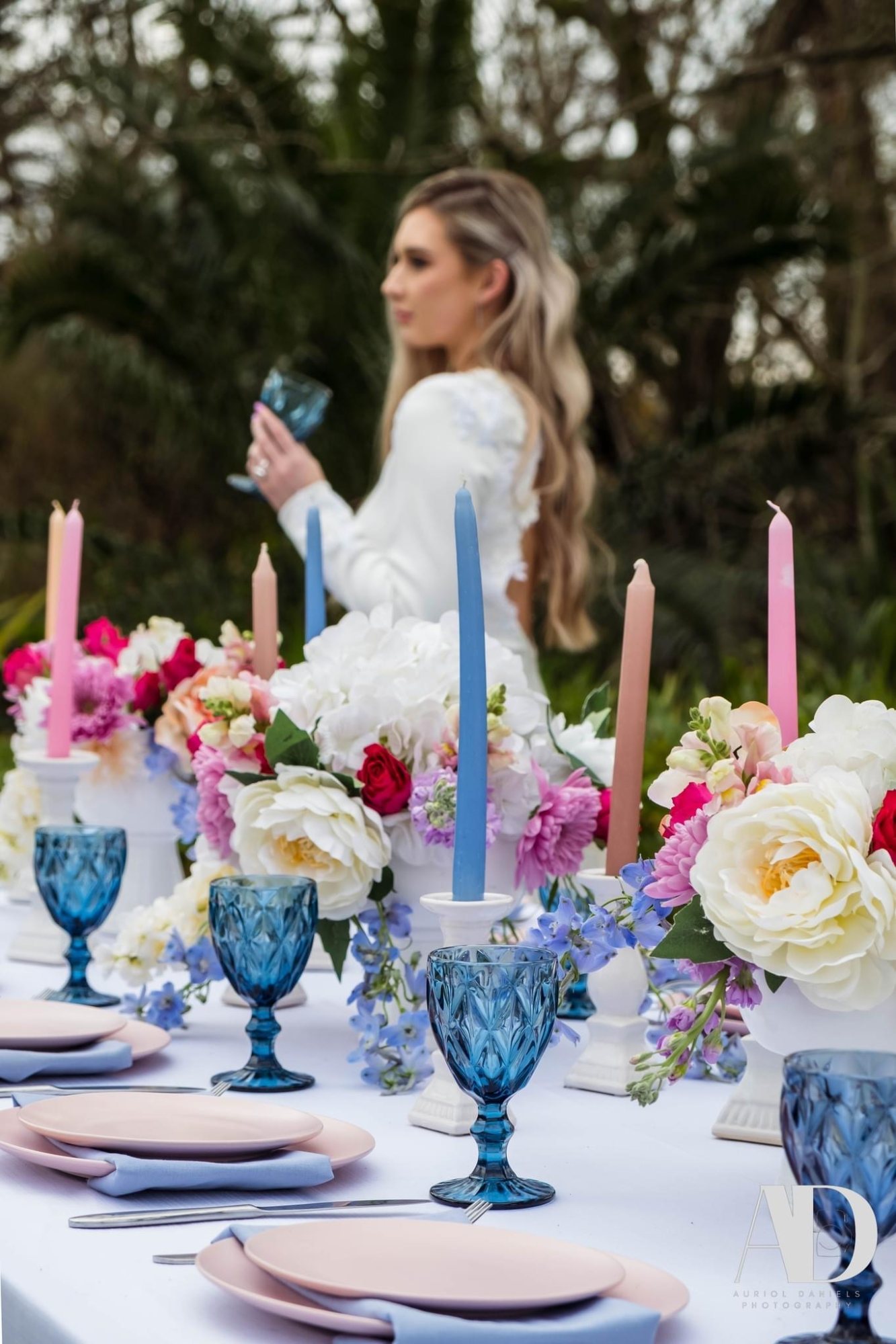 Beautifully set table with floral arrangements and decorative glassware