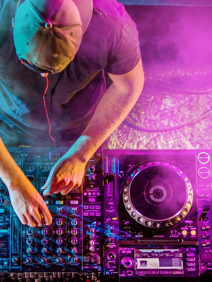 DJ mixing music with professional audio equipment