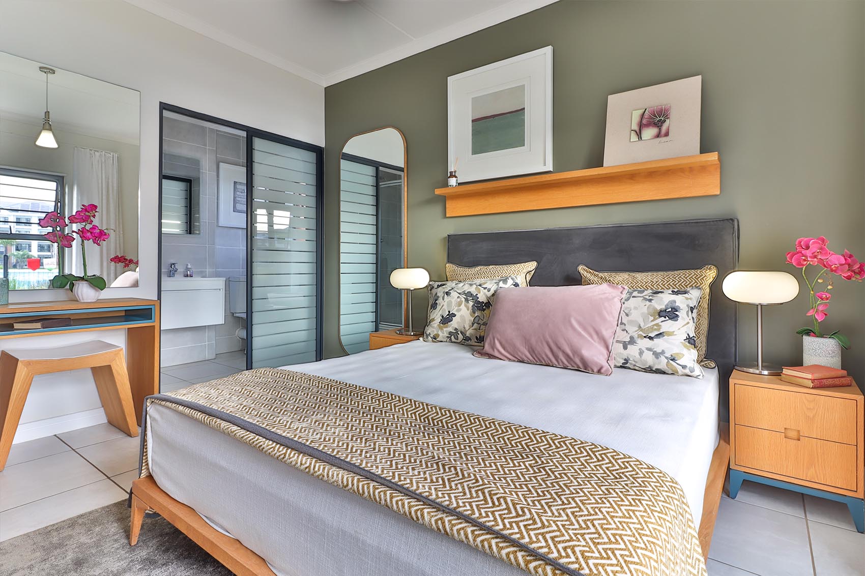 Cozy guest room with bed, decor, and lighting