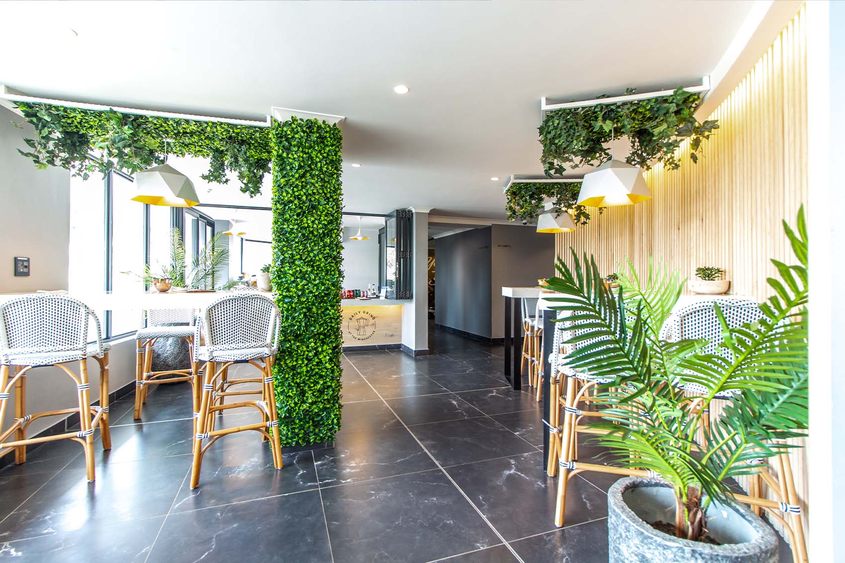 Indoor event space with green decor and seating