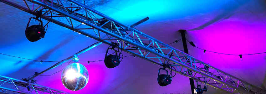 Truss lighting system with disco ball and purple lights.