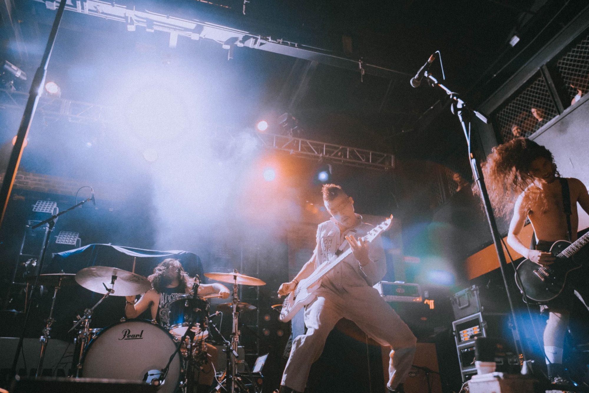 Band performing live with lights and sound setup