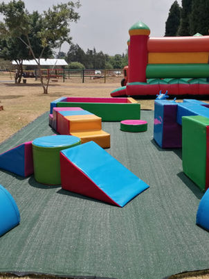 Colorful soft play equipment in a kids' park area