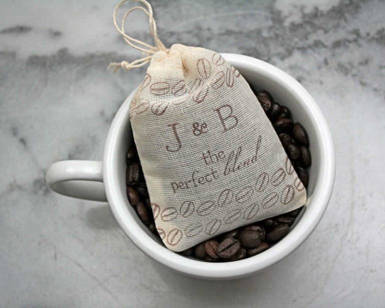 Fabric coffee bag in a cup of coffee beans.