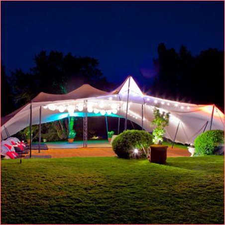 Illuminated stretch tent set up for an outdoor event