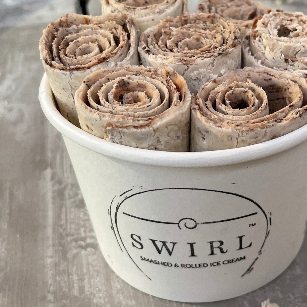 Cup with rolled ice cream swirls