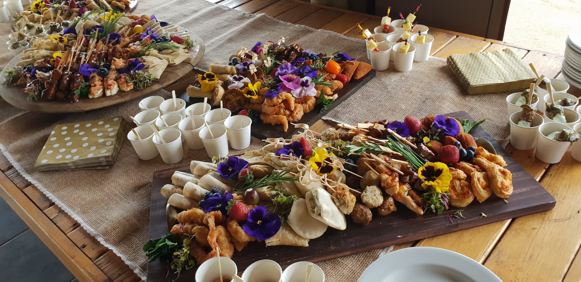 Gourmet party platters featuring assorted foods and garnishes