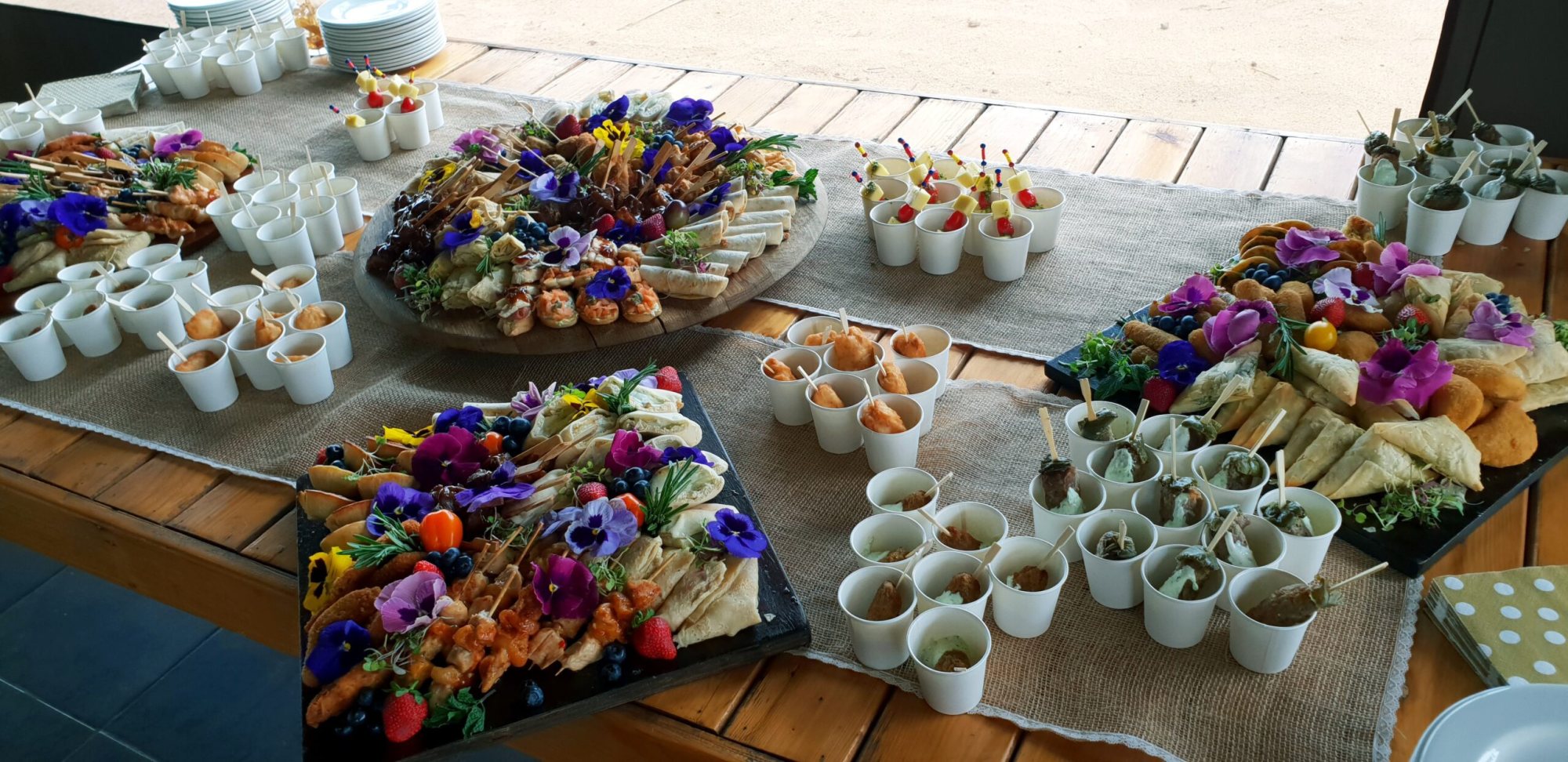 Elegant catering spread with gourmet platters and small servings