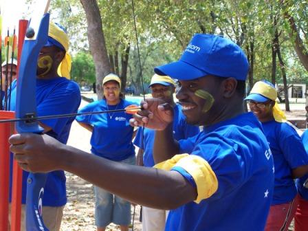 Participants engaged in an archery team-building activity