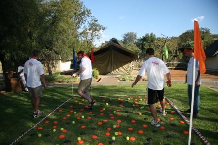 Team members participating in an outdoor team-building challenge